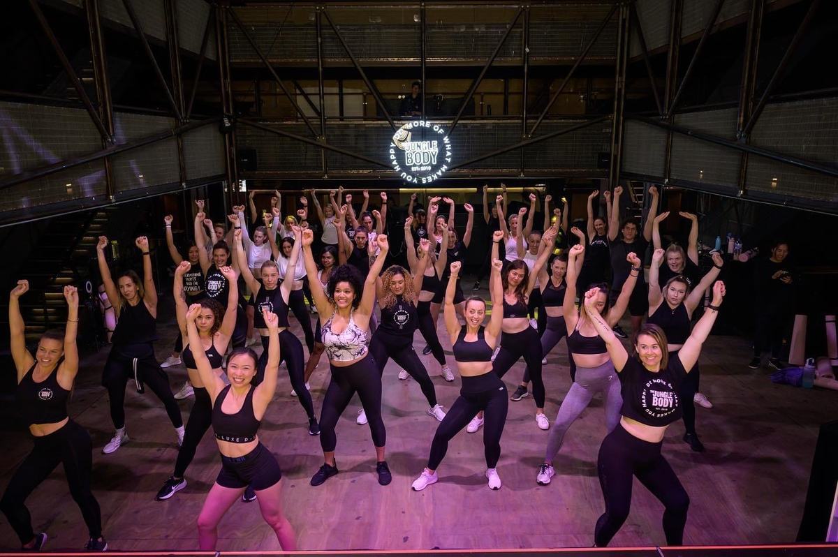 A large Jungle Body class with arms raised